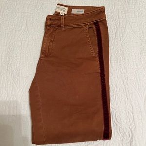 Beautiful brownish chinos with a velvet burgundy ribbon down the side